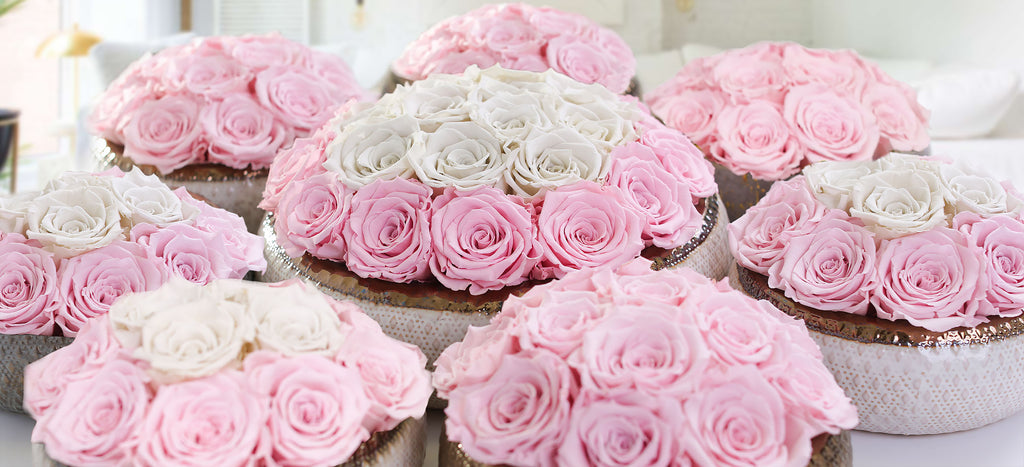 Pink rose centerpieces in ceramic bowls